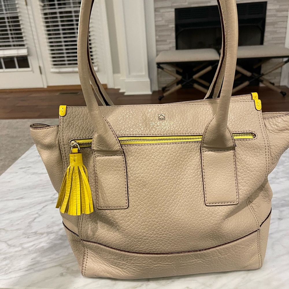 Kate Spade Beige Pebble Leather Tote with Yellow Tassel